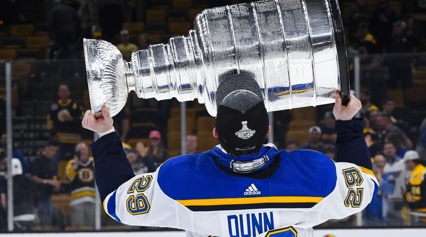 Vince Dunn of the St. Louis Blues hoists the Stanley Cup